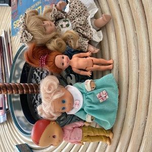 4 miniature dolls. Great for a doll house to play with. See pictures